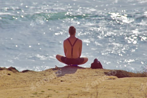 Preview: Man doing yoga, waiting for the sunset