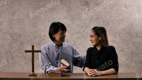 Preview: Young missionary is giving Bible advice to young woman in church.