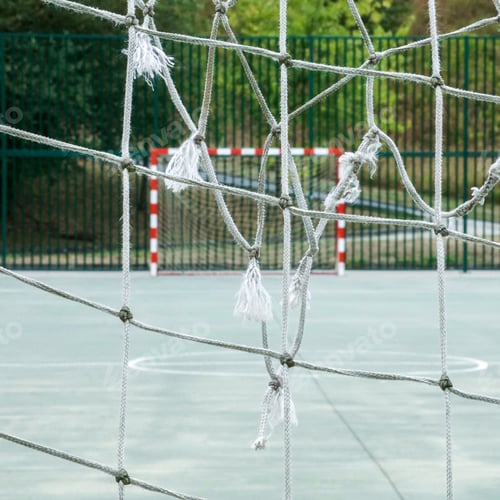 Preview: Professional-grade soccer goal frame with netting and lacing securely attached
