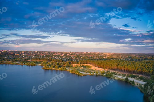 Preview: Lake near the forest and the city in the background