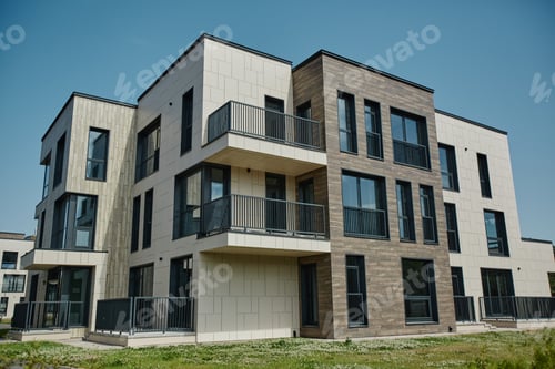 Preview: Modern apartment building in housing complex lit by sunlight