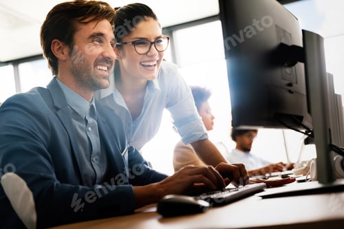 Preview: Group of happy multiethnic business people in a meeting at office