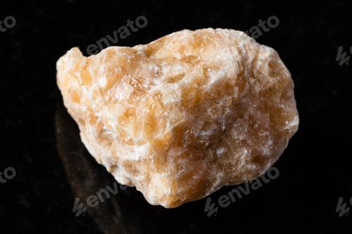 Preview: sample of uncut brown calcite mineral on black