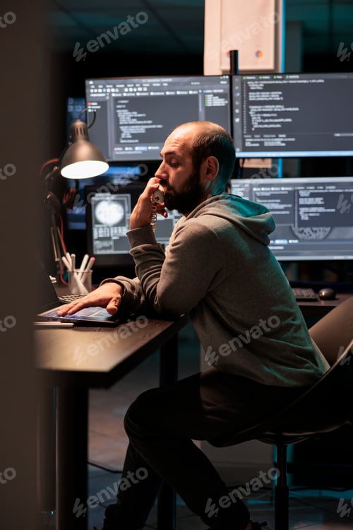 Preview: IT engineer answering landline phone call in office