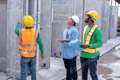 Preview: At building construction site supervisor check quality precast concrete panel before installation