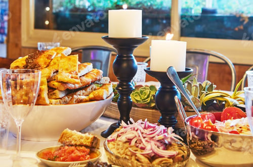 Preview: Table setting with fermented vegetables, focaccia bread and candles
