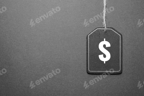 Preview: Black price tag with a dollar symbol isolated on gray background with copy space