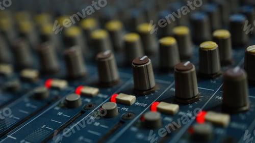 Preview: Closeup shot of an audio sound mixer with sliders buttons