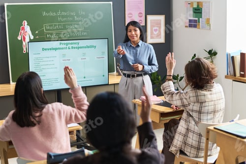 Preview: Young Hispanic Woman Leading Health Science Discussion with Teenagers