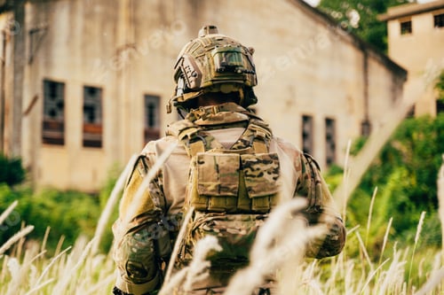 Preview: Soldier Wearing Gear Standing Near Abandoned Building