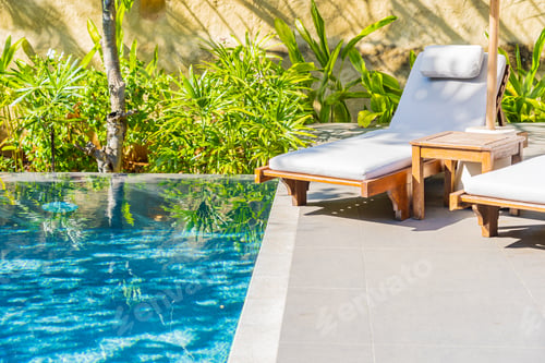 Preview: Umbrella and chair around outdoor swimming pool