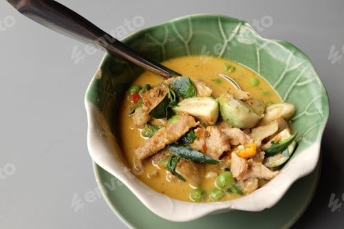 Preview: Thai Green Pork Curry On A Gray Background.