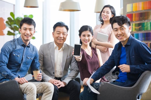 Preview: Business team showing a smart phone