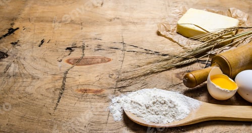 Preview: Preparation of the dough. Ingredients for the dough - egg, flour, butter with a rolling pin.