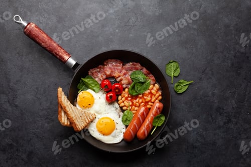 Preview: English breakfast with fried eggs, beans, bacon and sausages