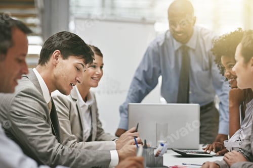 Preview: Cropped shot of a group of businesspeople meeting in the boardroom