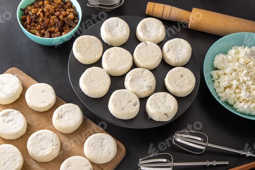 Preview: Cheesecakes made from cottage cheese and raisins. Prepare food for breakfast. Syrnik pancakes. Round