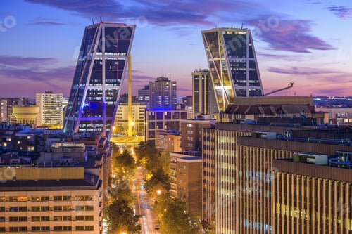 Preview: Madrid, Spain Financial District Skyline At Twilight Viewed Towards The Gate Of Europe Plaza.