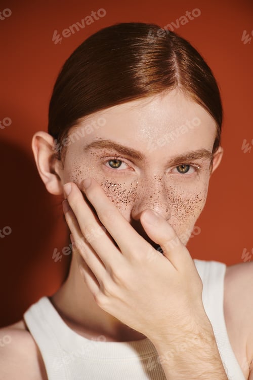 Preview: Young and stylish queer man expressing individuality in modern portrait