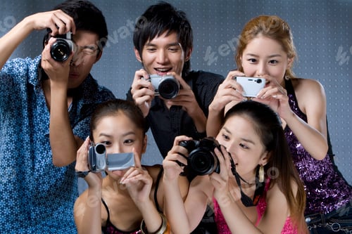 Preview: Young adults using digital cameras