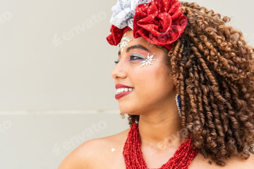 Preview: Close-up of woman with festive makeup and headpiece at a carnival