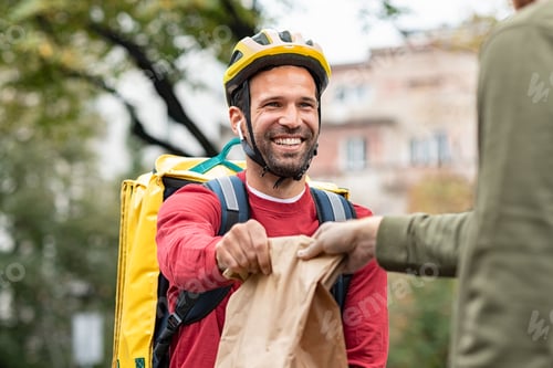 Preview: Delivery Man Passes Package to Customer Outdoors