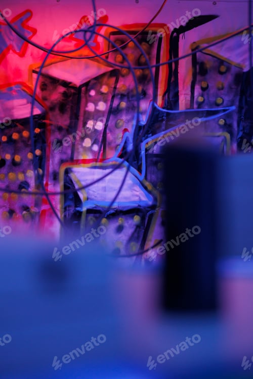 Preview: Graffiti art on walls glowing under bright purple lights