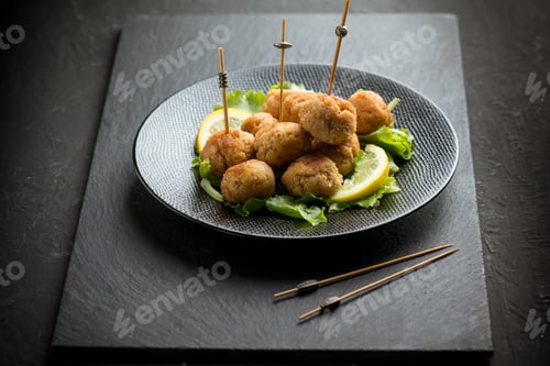 Preview: salmon meatballs with lemon and salad