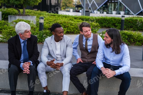 Preview: Group of business people taking a break in business district