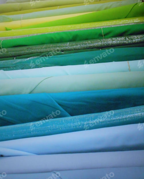 Preview: Colorful Background! A stack of colorful bolts of fabric