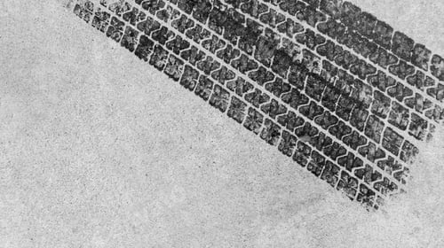 Preview: Top view tire marks on the asphalt road, Abstract texture and background black tire tracks.