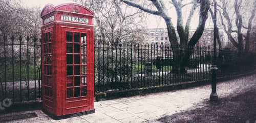 Preview: A red London telephone box or booth on a UK city street with copy space