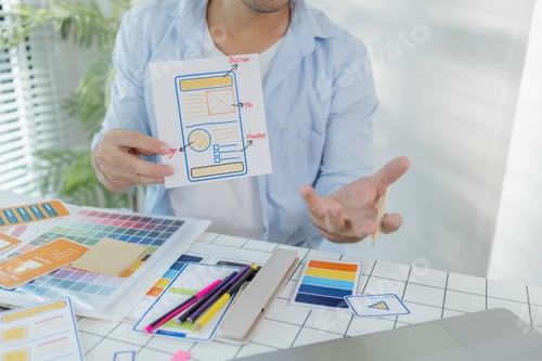 Preview: A focused designer is working on UX/UI design ideas