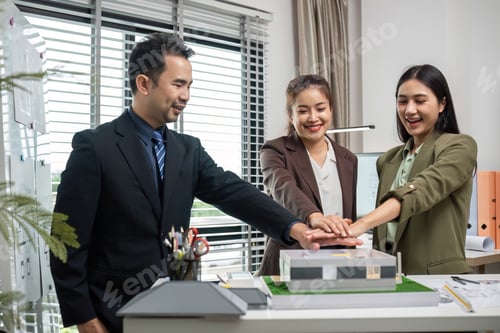 Preview: Business Team Collaborating on Real Estate Project Planning in Modern Office Setting with