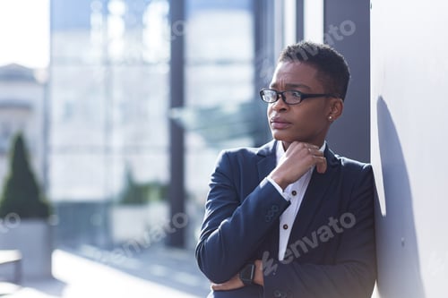 Preview: Close-up photo of an office worker, tired and overworked, has a severe headache