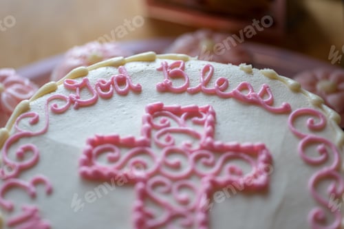 Preview: Closeup of beautifully decorated baptism cake for a baby girl