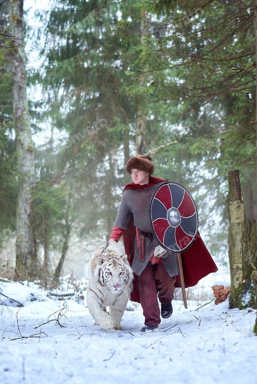 Preview: Man walks with tiger in winter forest