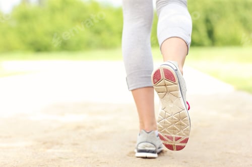 Preview: Back of jogger's legs on the path