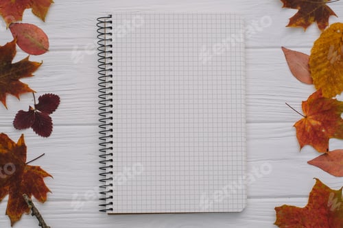 Preview: Background texture with old wooden table and yellow autumnal leaves.