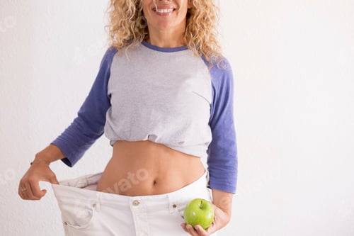 Preview: beautiful woman showing her old big pantalon after losing weight ah home