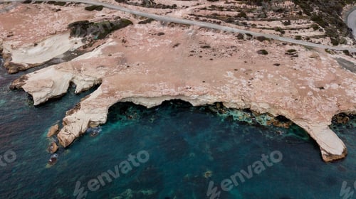 Preview: aerial view of sandstone rocks on seashore with blue water, Cyprus