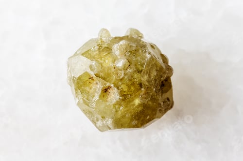 Preview: raw grossular garnet crystal with shoots on white