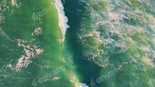 Preview: Top stormy sea surface waving with foam. Drone shot rough ocean waves rippling