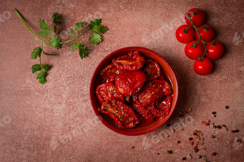 Preview: dried tomatoes, in a bowl, top view, on a brown background,
