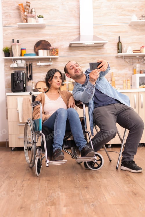 Preview: Romantic man taking selfie with wife