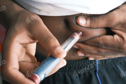 Preview: young man hand using insulin pen close up