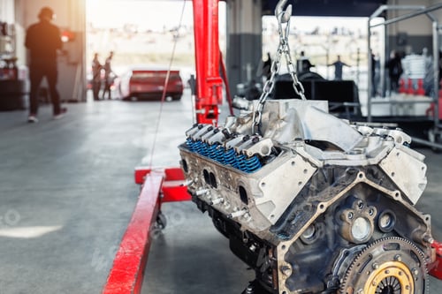 Preview: Motorsport pit lane garage box paddock hanged v8 engine suspended crane lift chain hook. Racing
