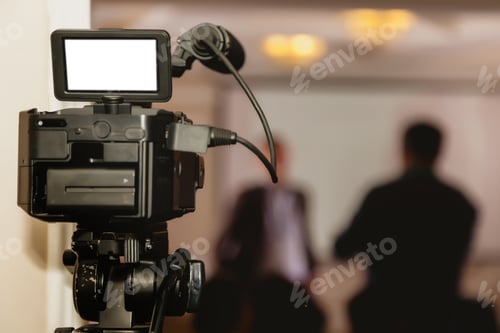 Preview: Video camera in conference room, recording participants and speakers