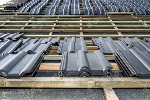 Preview: Roof ceramic tile arranged in packets on the roof on roof battens. laying tiles on a boarded roof.