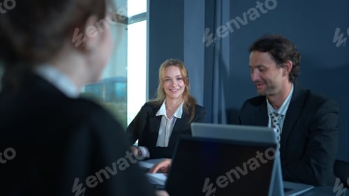 Preview: In the conference room, a group of businesspeople are discussing the follow-up meeting